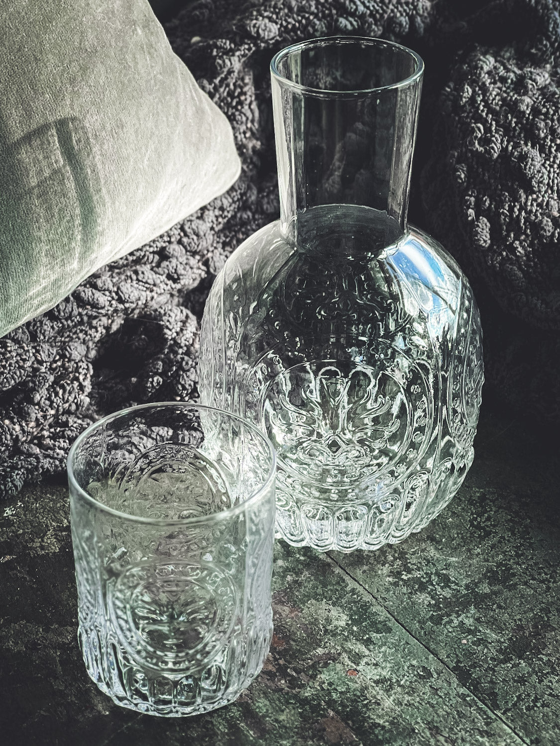 Anya Nesting Beside Carafe