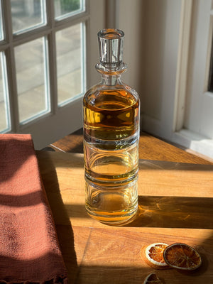 Simple Stacking Decanter & Tumbler Set on a cutting board