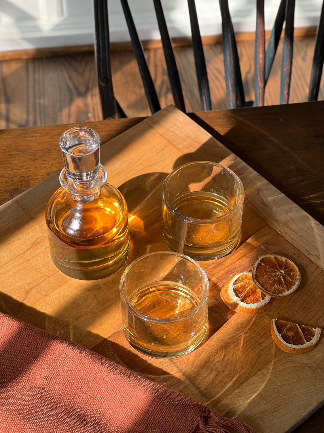 Simple Stacking Decanter & Tumbler Set on a cutting board