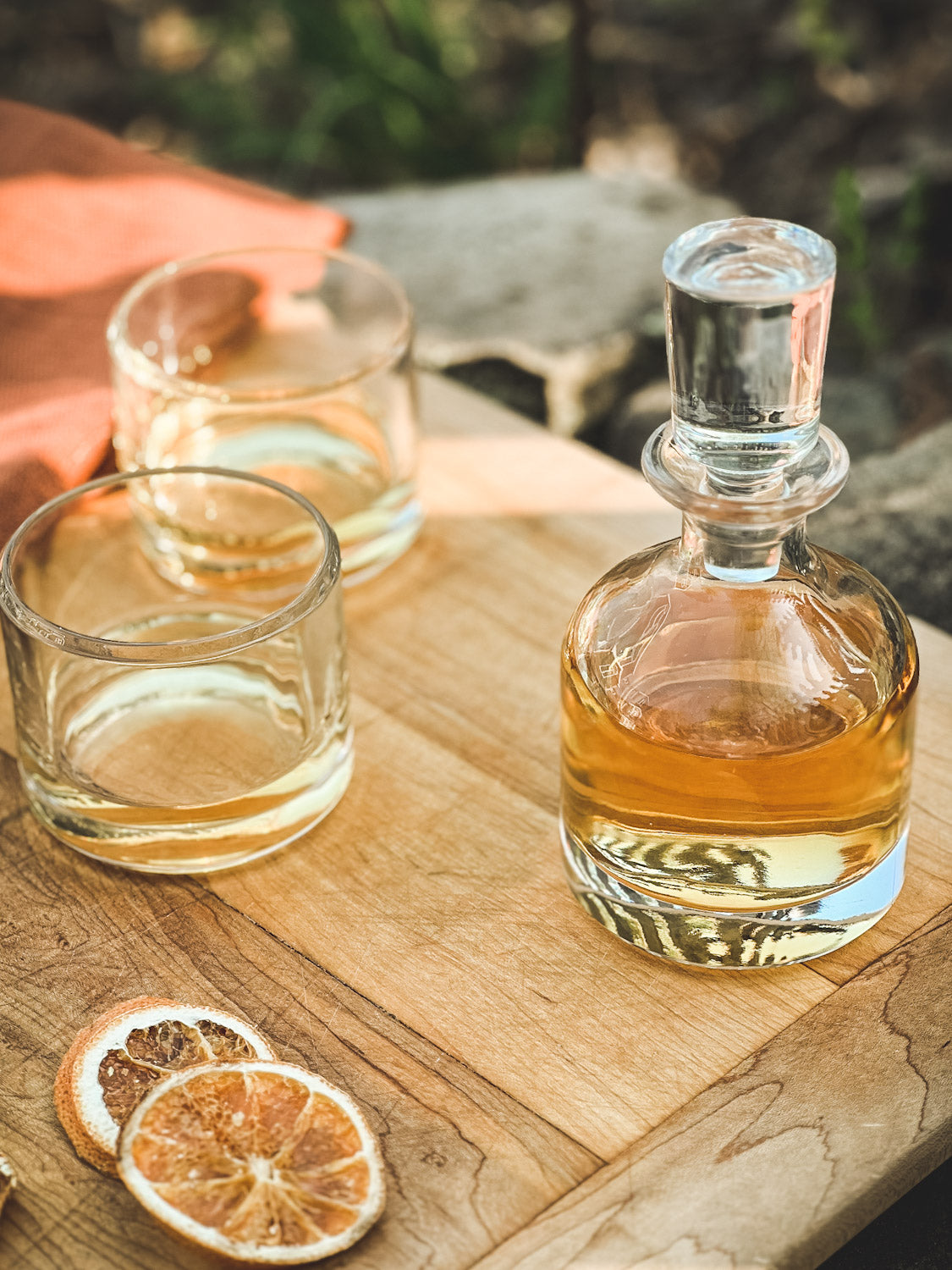 Simple Stacking Decanter & Tumbler Set on a cutting board