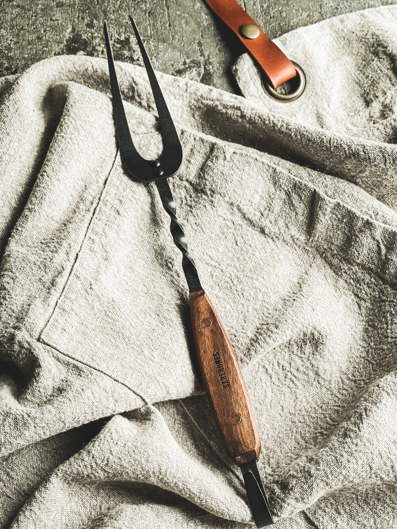 grilling fork over apron