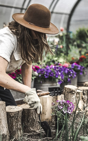 Woman gardening with Garden Trowel with wooden handle